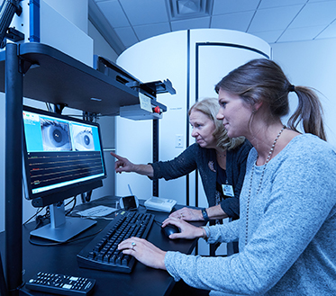 student and professor in CSD lab