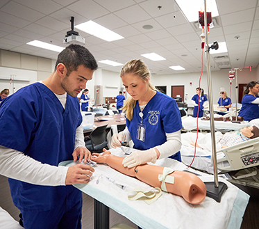 two nursing students in lab