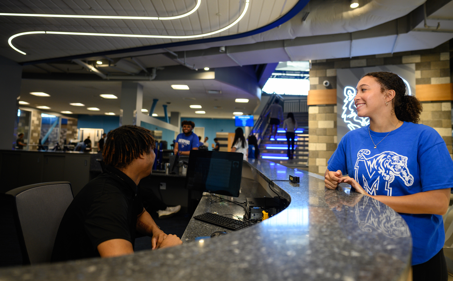 Student at front desk of rec center