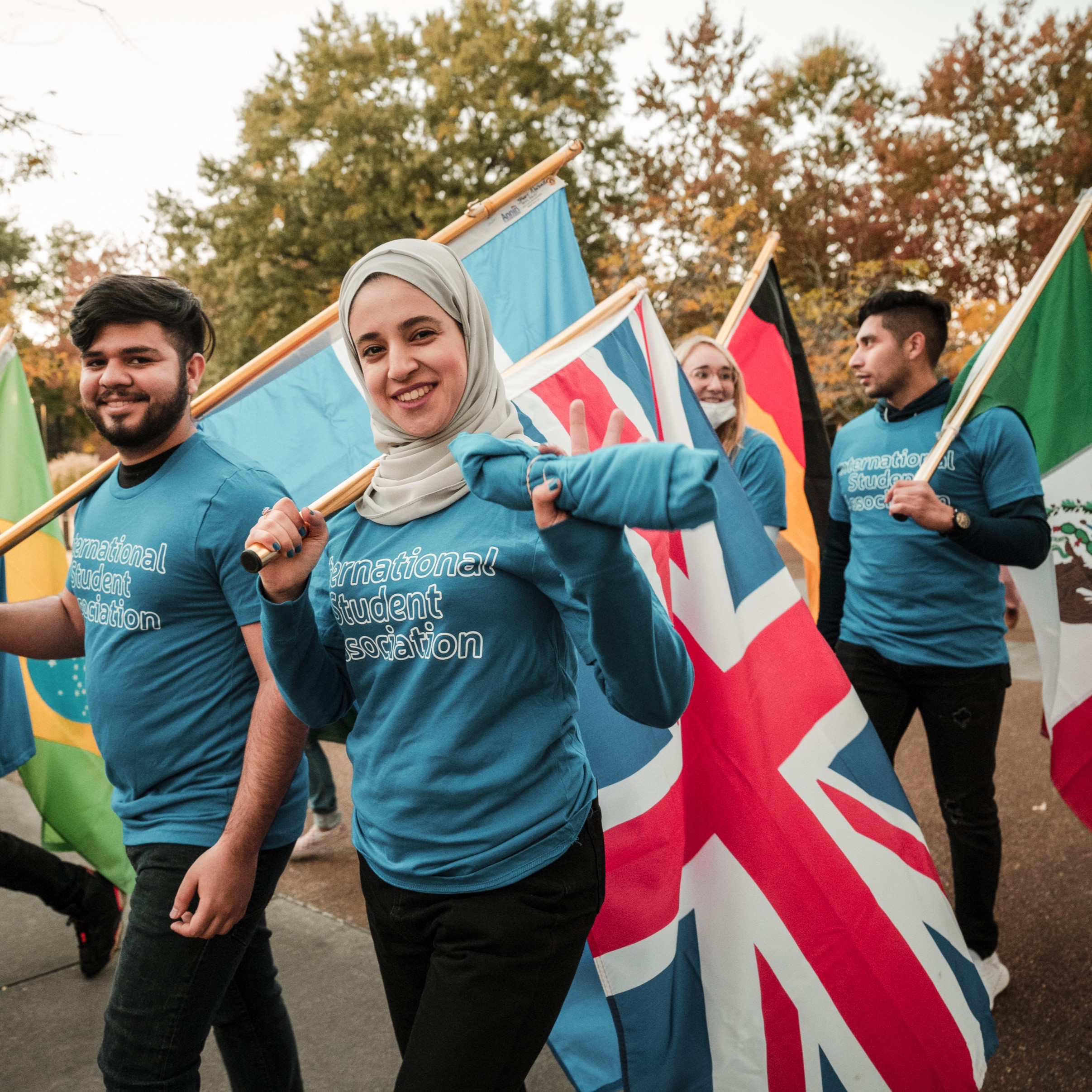 international students holding flags