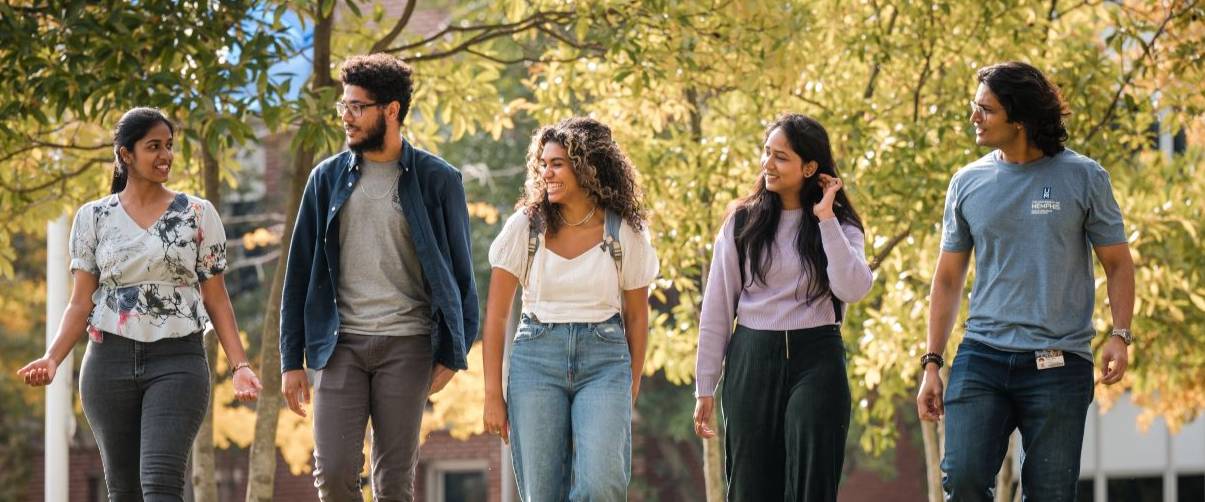 natural science header students walking on campus
