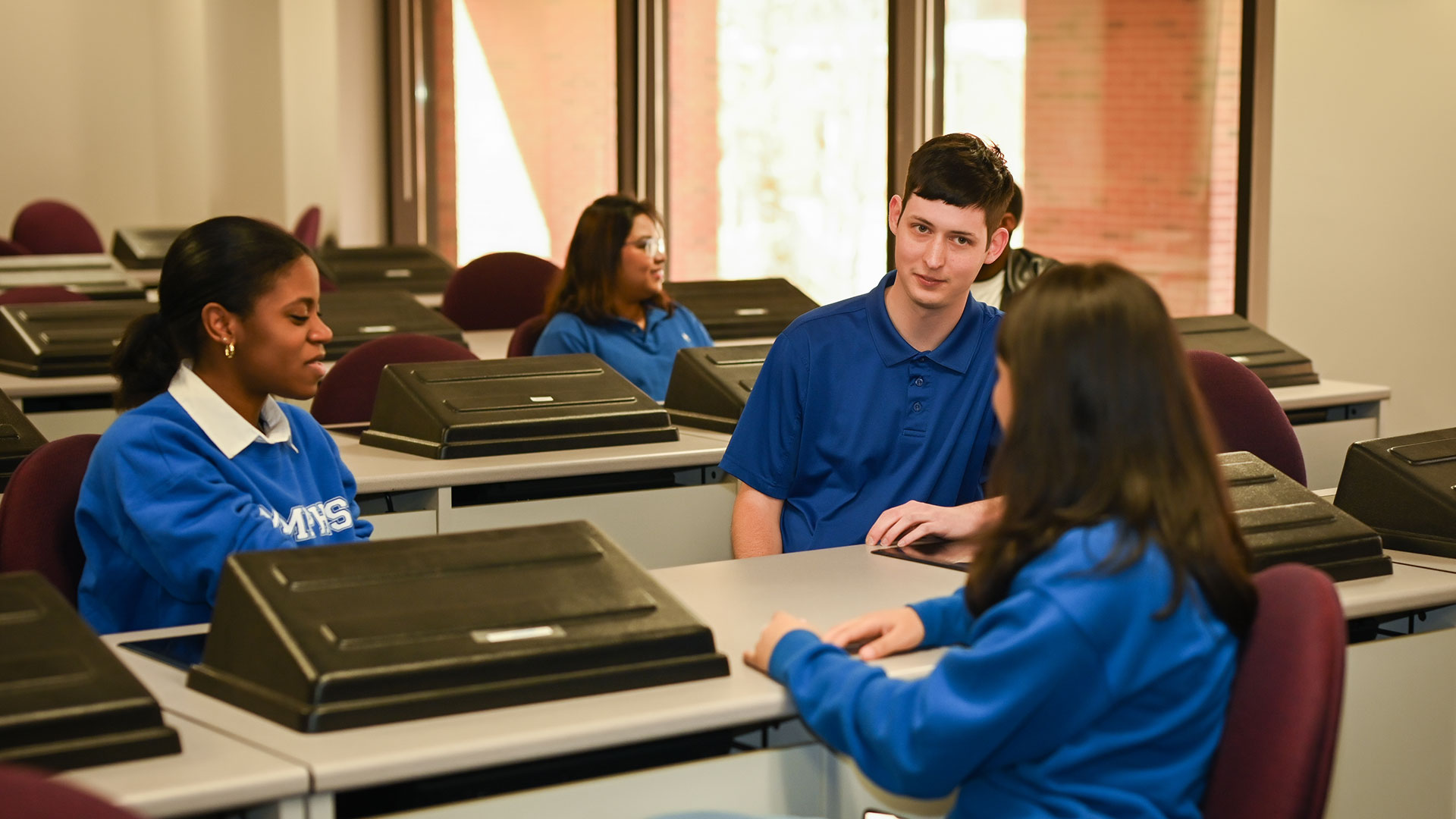 Students standing outside talking