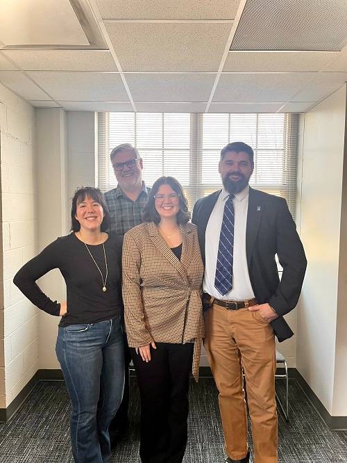 Madeline Stewart and faculty