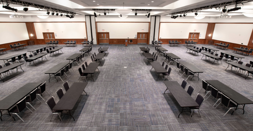 overhead view of the UC Ballroom ABC set with rectangular tables and chairs for a trade show