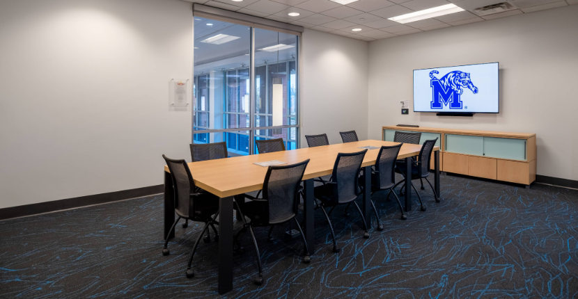 View of Conference Room 201 showing the table and screen