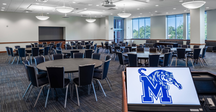 River Room with round tables and podium computer screen