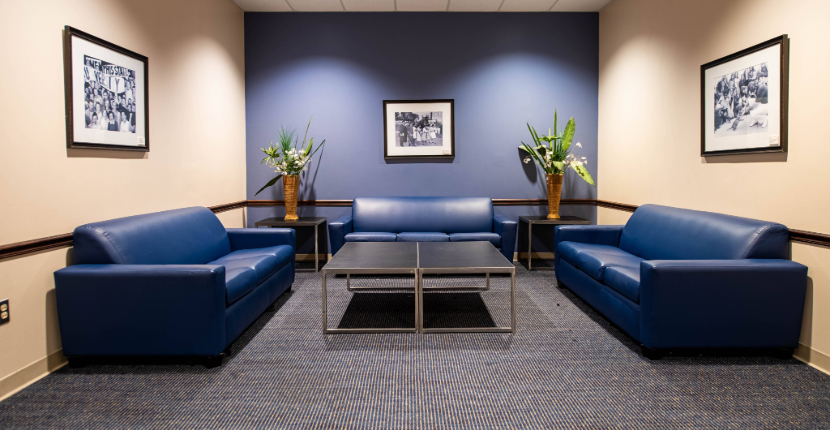 Rose Theatre Green Room with three couches, two side tables and one larger table