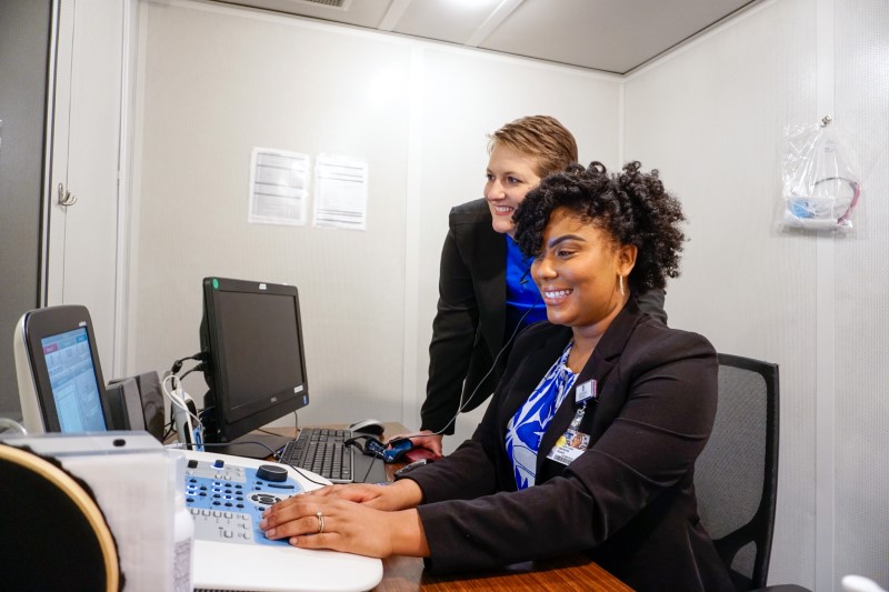 Dr. Sarah Warren provides supervision in the sound booth to 2nd year AuD student, Autumn Barron