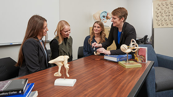 Dr. Warren in lab with students