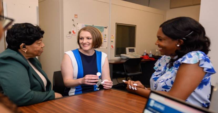 three women around table