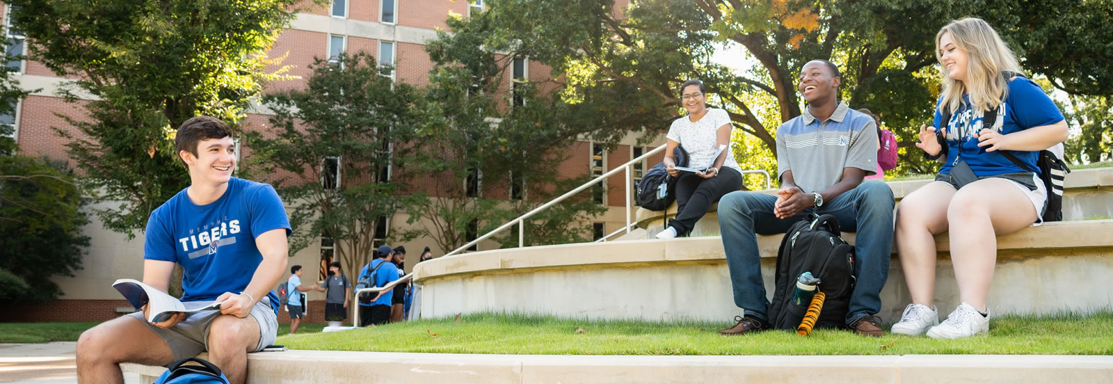 Students outdoors chatting with each other