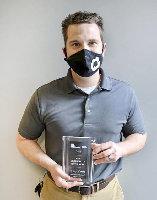 Andy Martin Andy Martin holding award