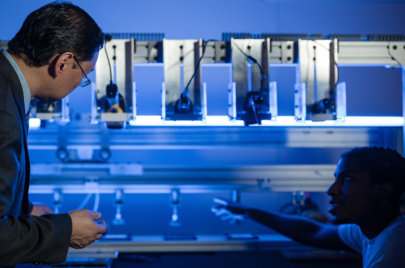 Kevin Berisso with student with RFID scanners