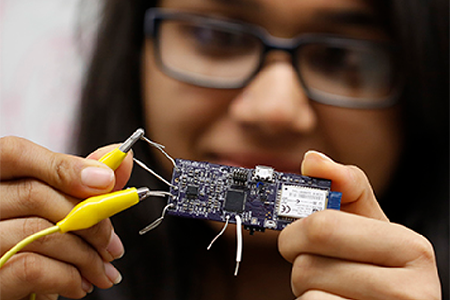 student working with electronics