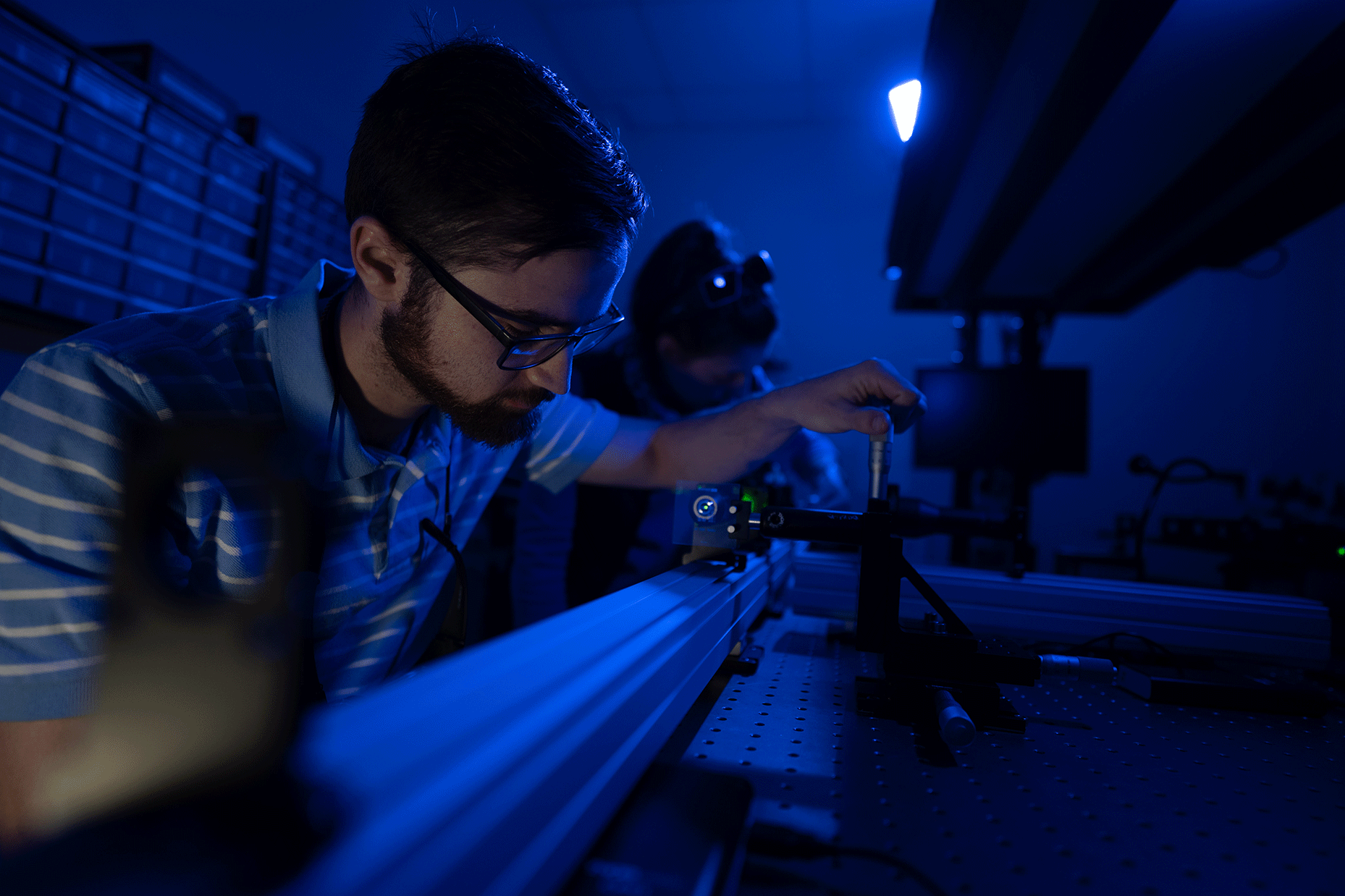 student working with a machine