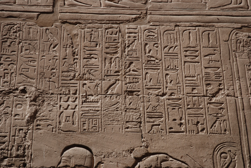 Plate 52 (B97-98) - Ramesses II receiving regalia and jubilees from Amun-Re in the presence of Mut and Khonsu, while Thoth inscribes years of reign (right, B97) and Iunmutef addresses the Great Ennead (left, B98)