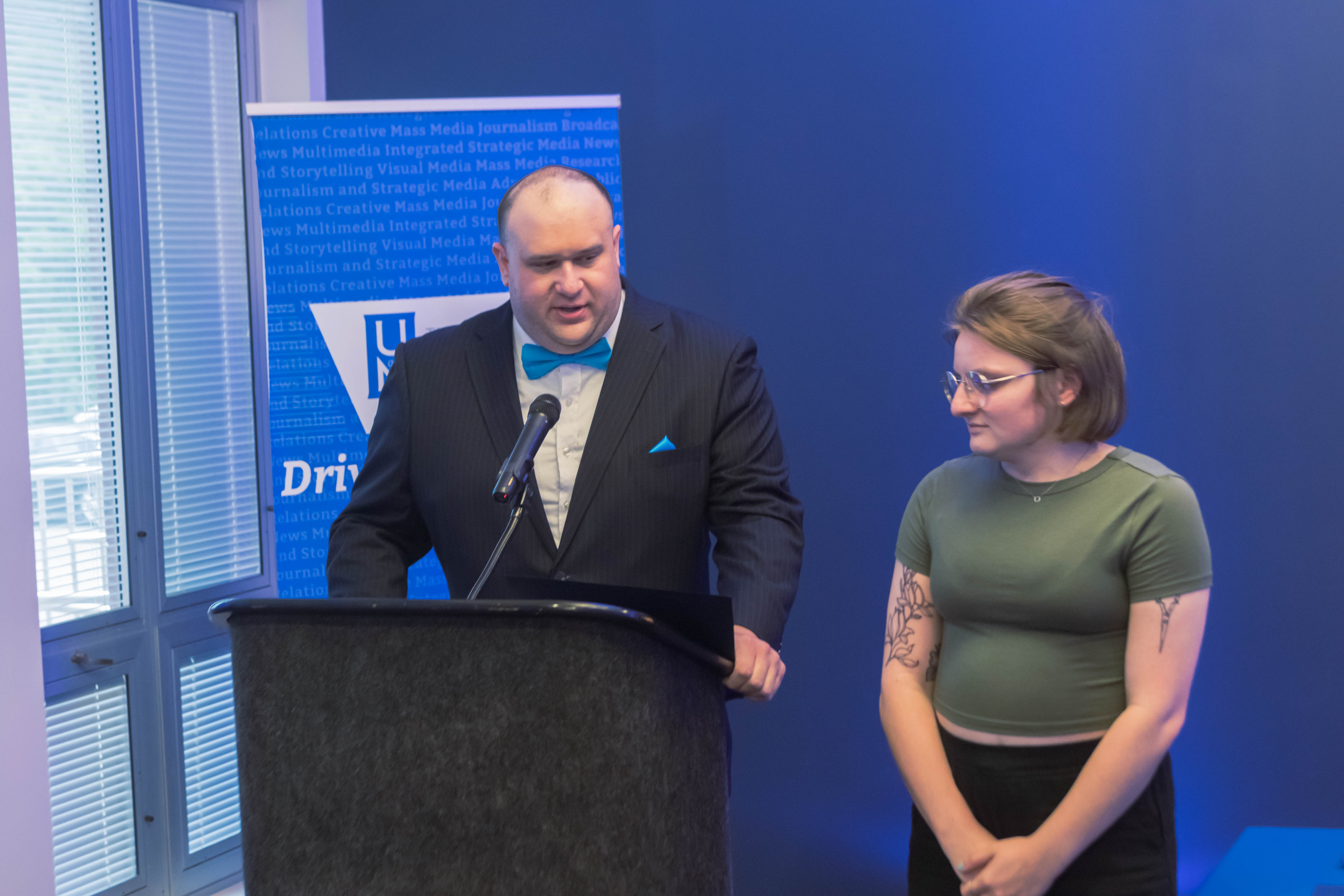 Professor Matt Haught recognizes Audrey Firrone as the Most Outstanding Graduate Student. Haught JRSM