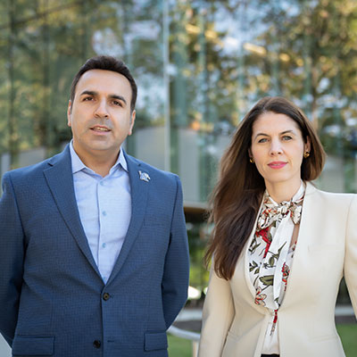 Dr. Maryam Karimi, associate professor in the School of Public Health (right), and Dr. Rouzbeh Nazari, chair and professor in the Department of Civil, Construction, and Environmental Engineering