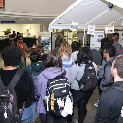 Daphene R. McFerren discusses &quot;Tent City&quot; display with students