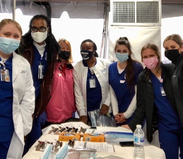 Picture of students with Professor Cotham Professor Cotham and students posing at Whitehaven Vaccination site