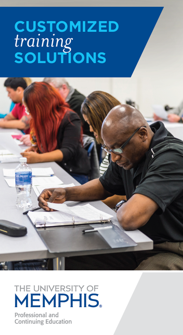 Customized Training Solutions Adult students in a classroom, reading