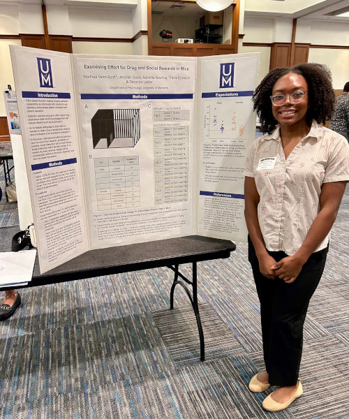 Marthea Vann-Scott presenting her poster at the UM Student Research Forum. Mentor: Dr. Deranda Lester