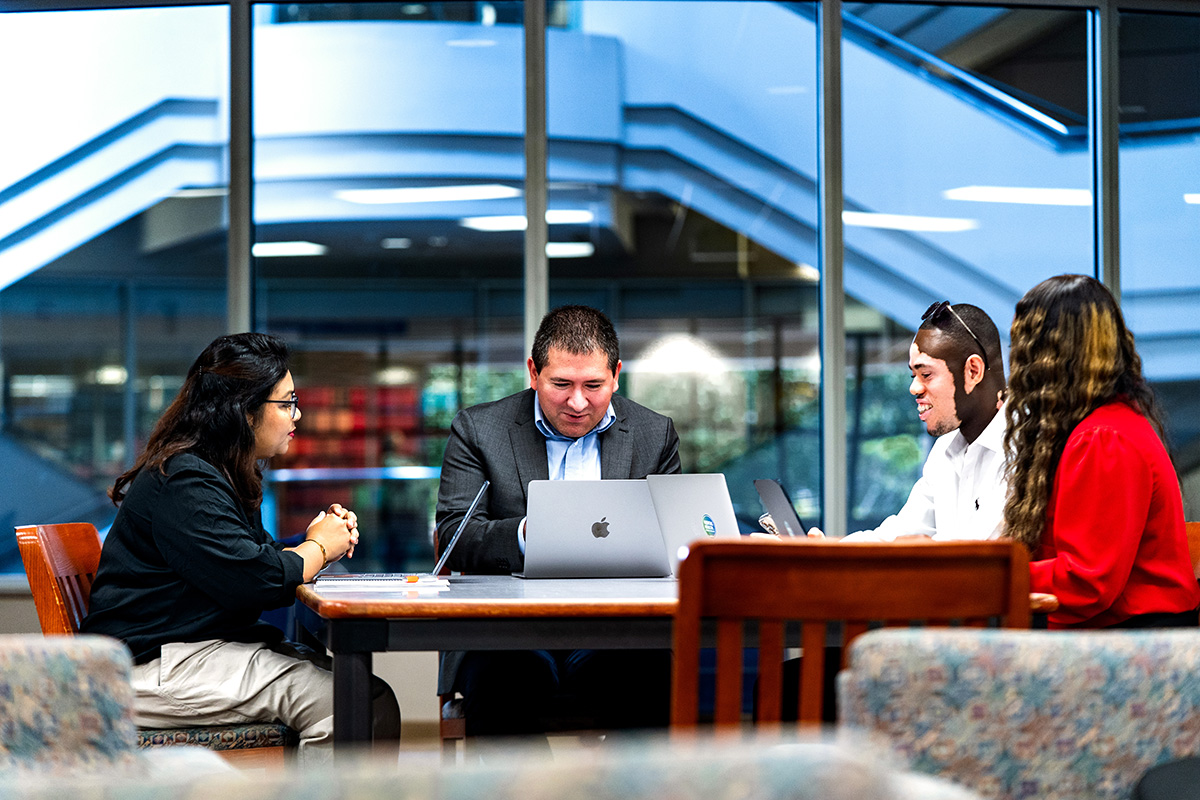 (Center to Right) Alex Parkhouse, Ph.D., MA, Dennis Tsegah, MBChB, Prada House, MPH (Far Left) Chitra Ghosh, MBBS, MPH