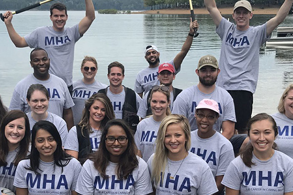 health leader at table with doctors