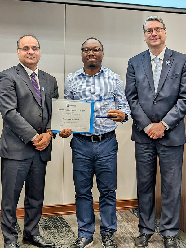 James Adefisoye receiving Award