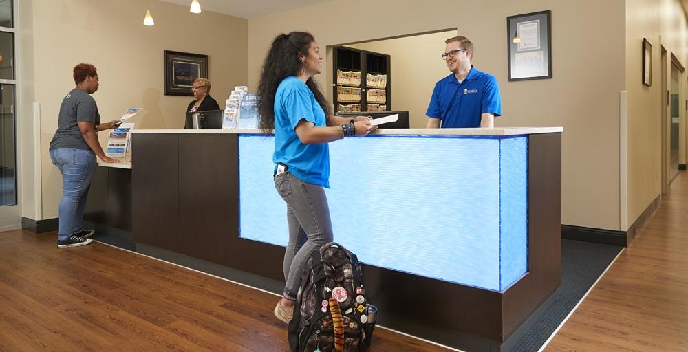 students at front desk