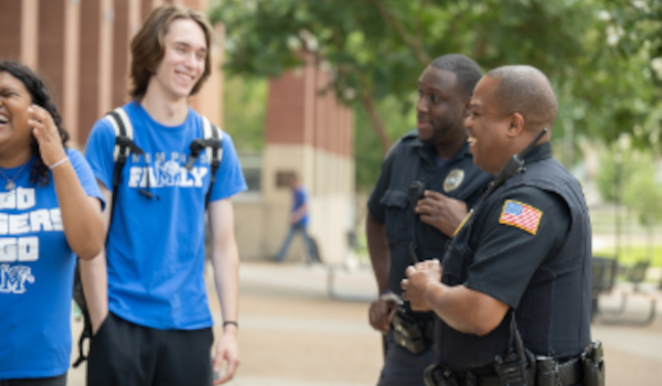 police speaking to student on campus