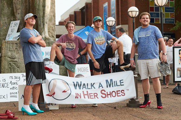 participants in the "Walk a Mile in Her Shoes" event