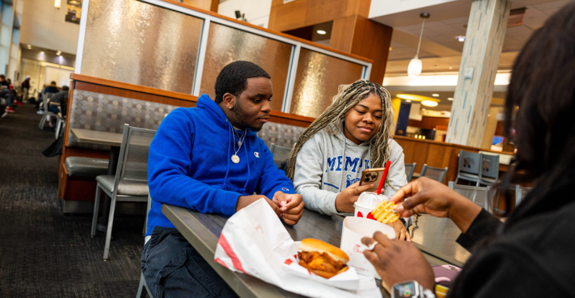 students eating in the Union dining room in the UC