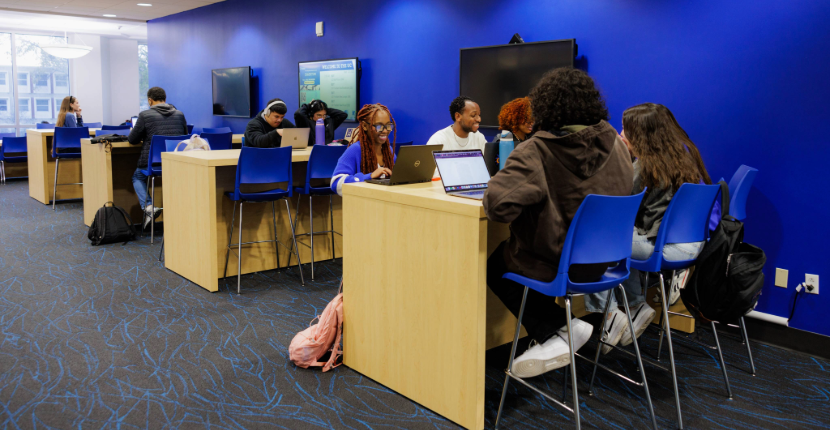 students studying in the alumni mall lounge in the UC