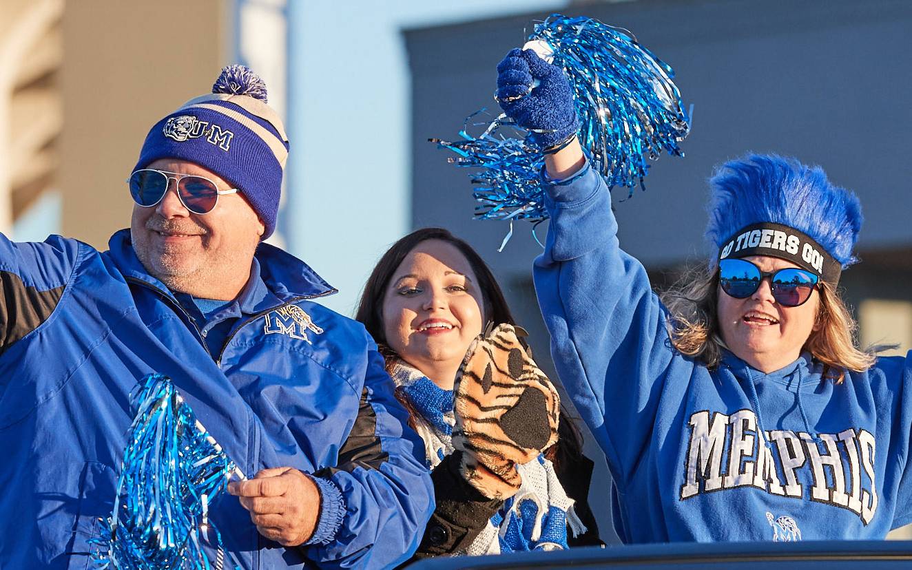 ;arents and student cheering at ball game