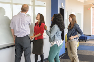 Group of students working on a whiteboard