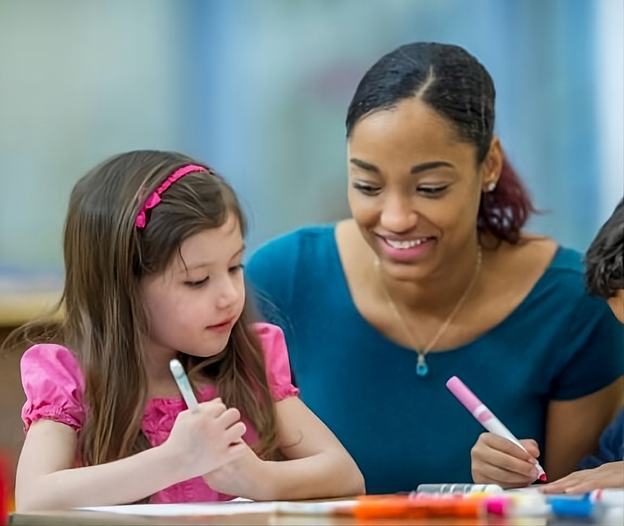 teacher and student in classroom