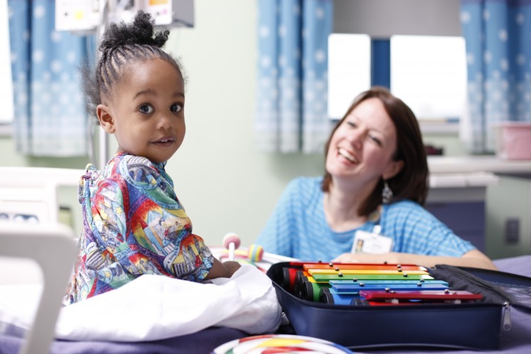 Young student with child life specialist