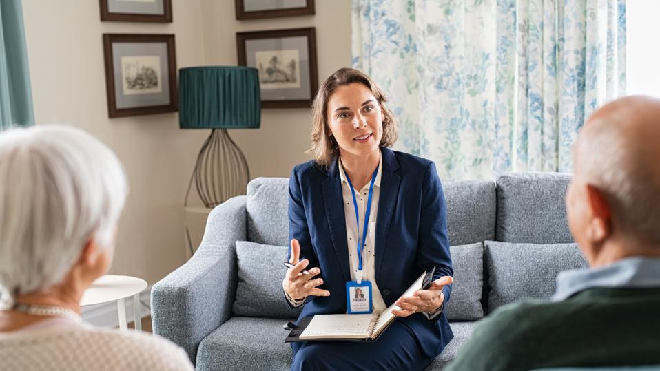 social worker with elderly couple