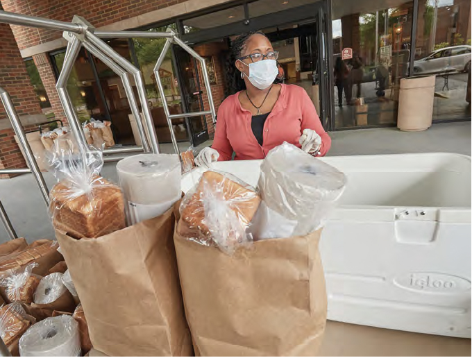 volunteer prepares packages