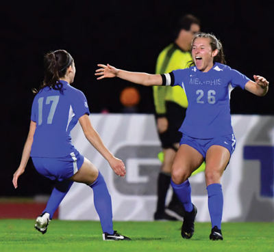 Mallin celebrates at game with teammate