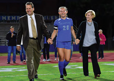 Mallin with parents at game