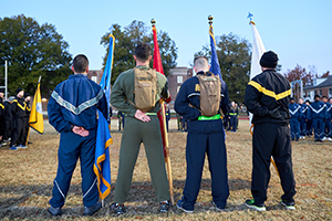 group standing with flags outside