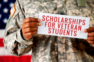 hands holding sign for scholarships for veteran students