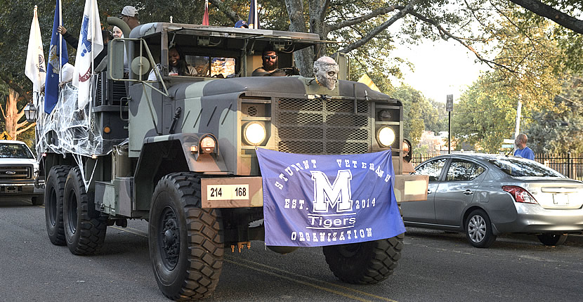 UofM flag on front of militay vehicle 