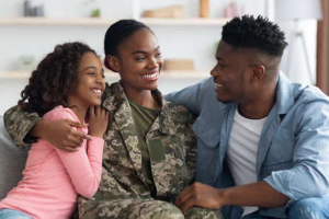 family sitting around military member